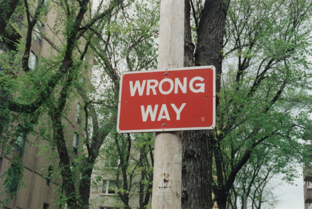 A road sign indicating the wrong path